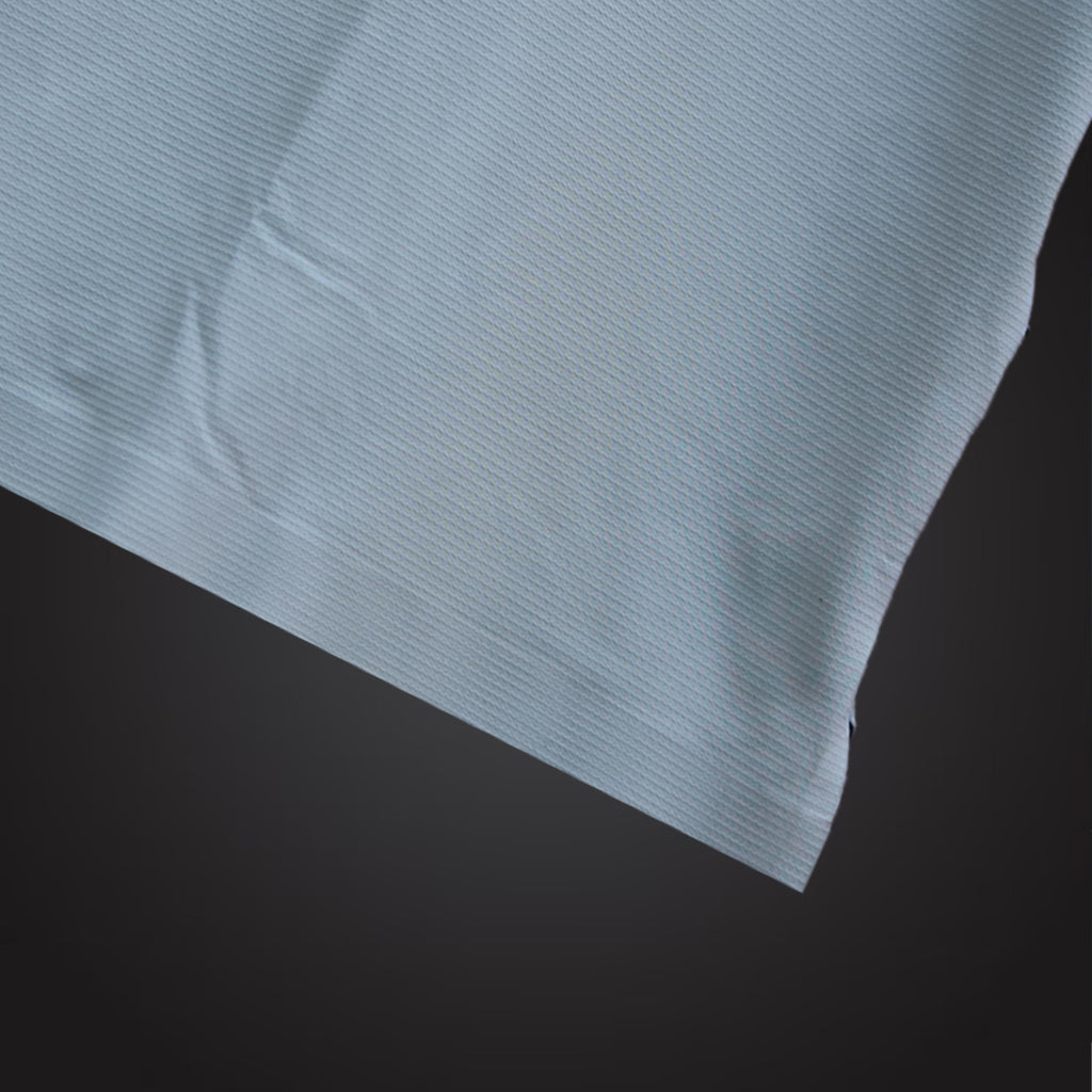 Close-up of a light blue fabric texture on a dark background