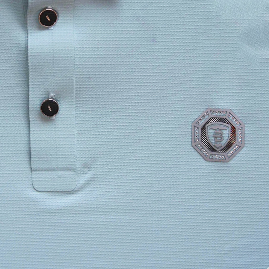 Light blue textured shirt with a brand logo on the chest.